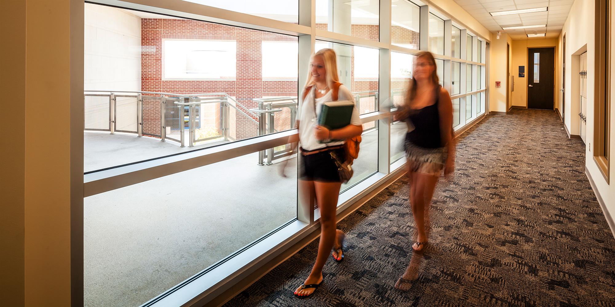 Students walking through hallway at San Jacinto College Central Building